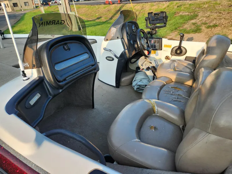 Slide: The Image of 2001 Nitro 896 DC boat interior with Garmin equipment and gray seating. - 8