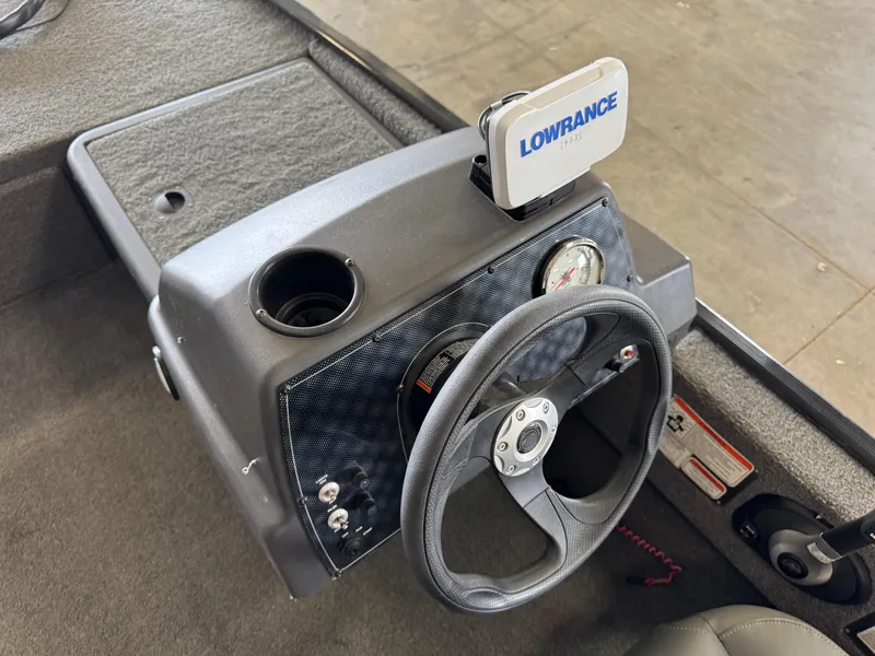 Slide: The Image of 2021 Tracker Bass Tracker Classic XL dashboard with Lowrance fish finder and steering wheel. - 12
