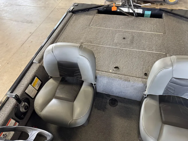 Slide: The Image of 2021 Tracker Bass Tracker Classic XL boat interior with two gray seats and carpeted deck. - 15