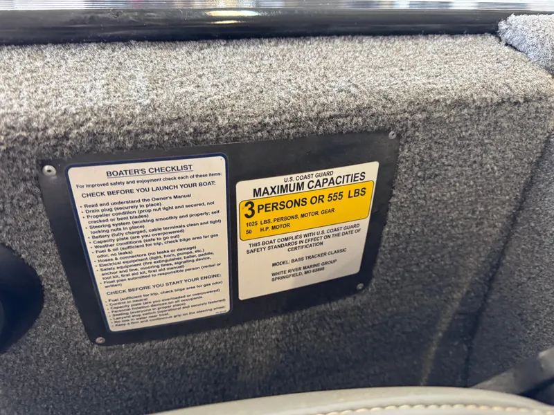 Slide: The Image of 2021 Tracker Bass Tracker Classic XL capacity label, 3 persons or 555 lbs, boater's checklist. - 16