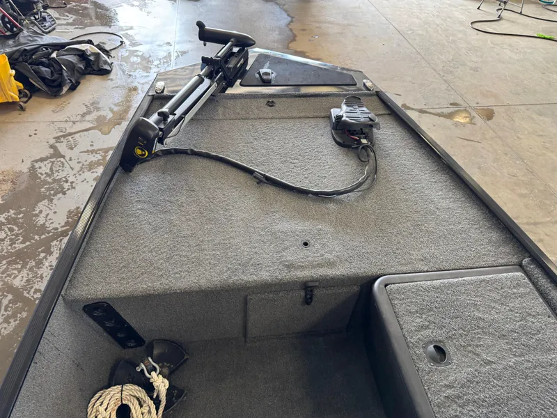 Slide: The Image of 2021 Tracker Bass Tracker Classic XL boat deck with trolling motor and storage compartments. - 7