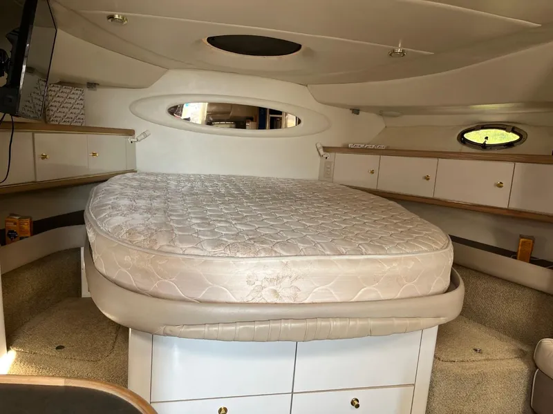 Slide: The Image of Interior cabin of 1996 Maxum 4100 SCR yacht with bed and storage cabinets. - 14