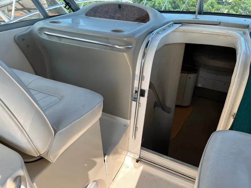 Slide: The Image of 1996 Maxum 4100 SCR boat interior with seating and cabin entrance. - 9