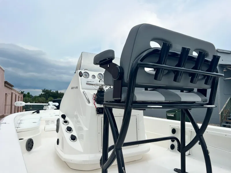 Slide: The Image of 2023 NauticStar 227 XTS boat interior with helm and seating. - 12