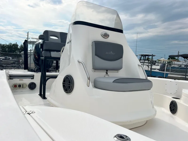 Slide: The Image of 2023 NauticStar 227 XTS boat with sleek seating and modern design. - 3