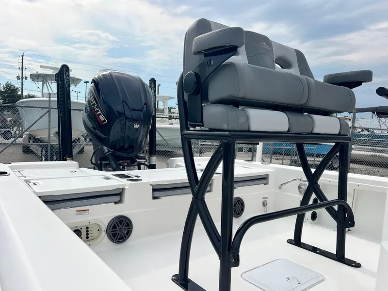 Slide: The Image of 2023 NauticStar 227 XTS boat with Yamaha outboard motor, featuring sleek seating and storage compartments. - 4