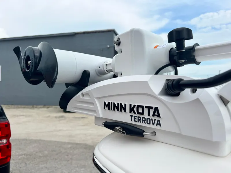 Slide: The Image of Minn Kota Terrova motor on 2023 NauticStar 227 XTS boat, outdoor setting. - 9