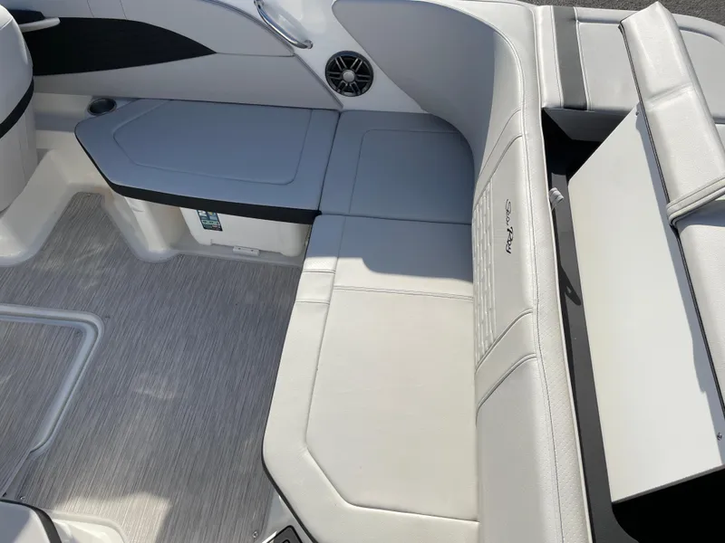 Slide: The Image of 2023 Sea Ray SPX 210 boat interior with sleek seating and modern design. - 2