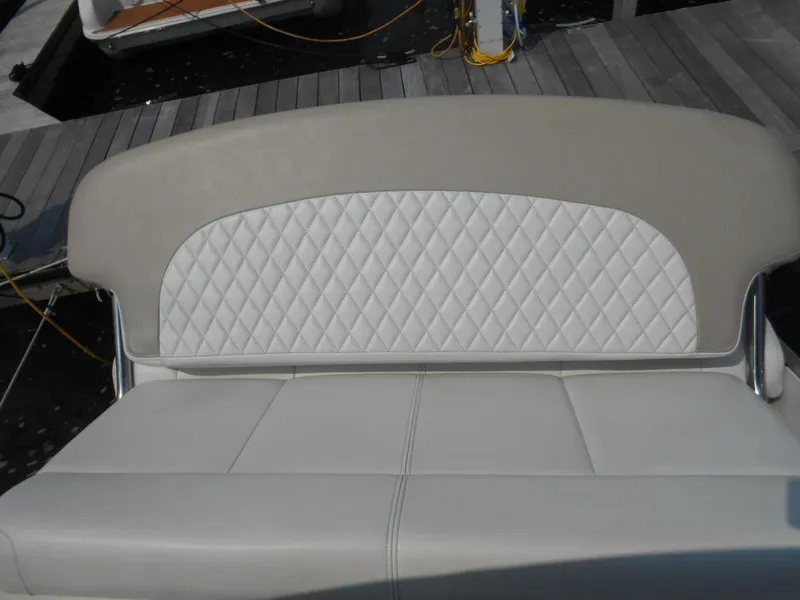 Slide: The Image of 2014 Chaparral 270 Signature boat seat with diamond-patterned upholstery. - 14