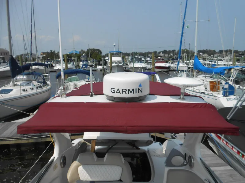 Slide: The Image of 2014 Chaparral 270 Signature boat with Garmin radar, docked in a marina. - 18