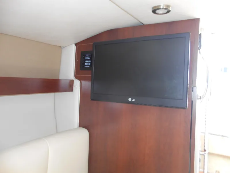Slide: The Image of Interior of 2014 Chaparral 270 Signature with wall-mounted LG TV. - 23