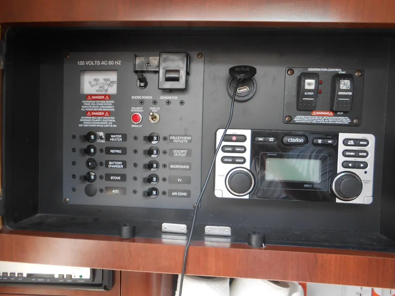 Slide: The Image of Electrical control panel and stereo system in a 2014 Chaparral 270 Signature boat. - 25