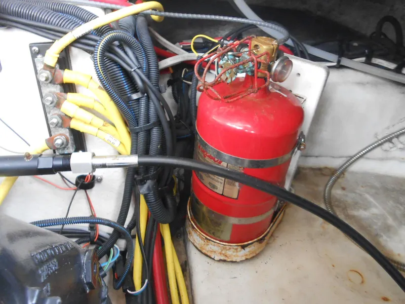 Slide: The Image of Engine compartment of 2014 Chaparral 270 Signature with fire extinguisher and wiring. - 27