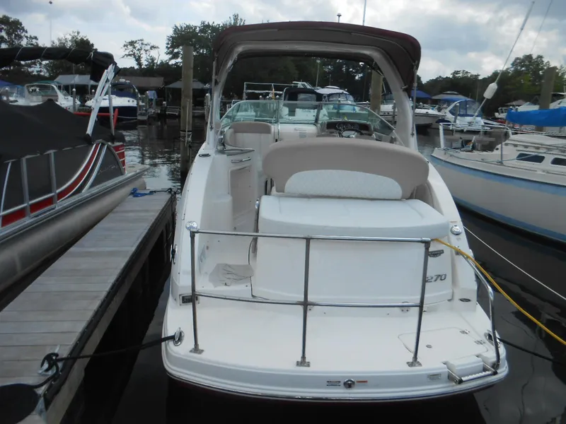Slide: The Image of 2014 Chaparral 270 Signature boat docked at marina, rear view. - 4