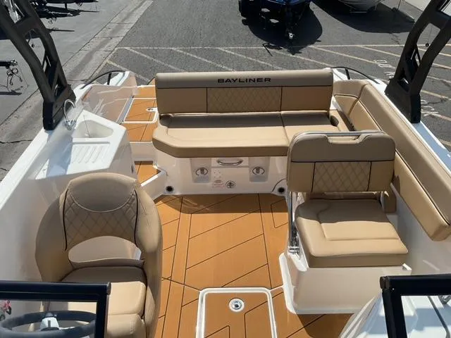 Slide: The Image of 2025 Bayliner D22I boat interior with tan seating and modern design. - 8
