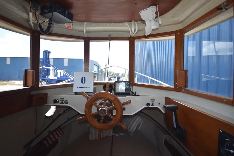 Slide: The Image of Interior view of 1994 Ranger Tugs R21 boat cockpit with wooden steering wheel. - 19