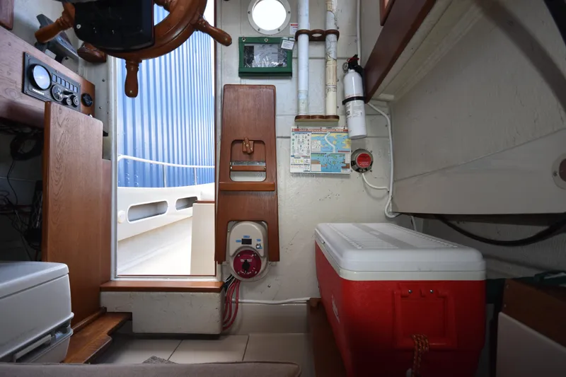 Slide: The Image of Interior of 1994 Ranger Tugs R21 boat with navigation equipment and storage. - 24