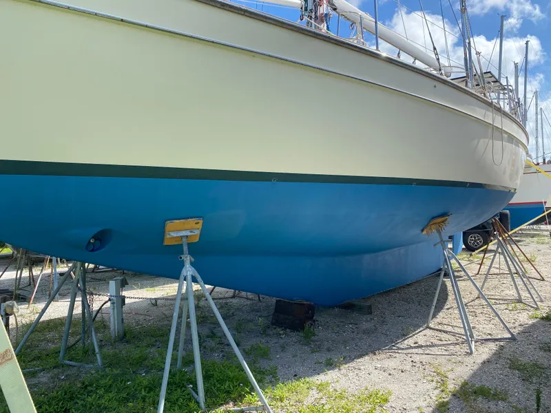 Slide: The Image of 2001 Island Packet 420 sailboat on stands in dry dock. - 35