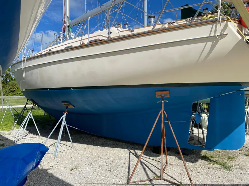 Slide: The Image of 2001 Island Packet 420 sailboat on stands in dry dock. - 36