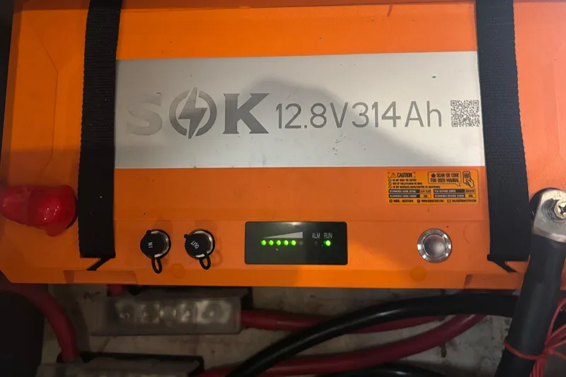Slide: The Image of Orange SOK 12.8V 314Ah battery in a 2001 Island Packet 420 sailboat. - 41