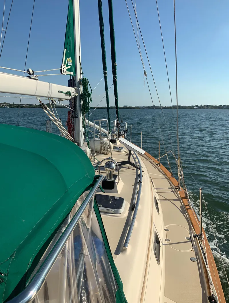 Slide: The Image of 2001 Island Packet 420 sailboat cruising on calm waters. - 7