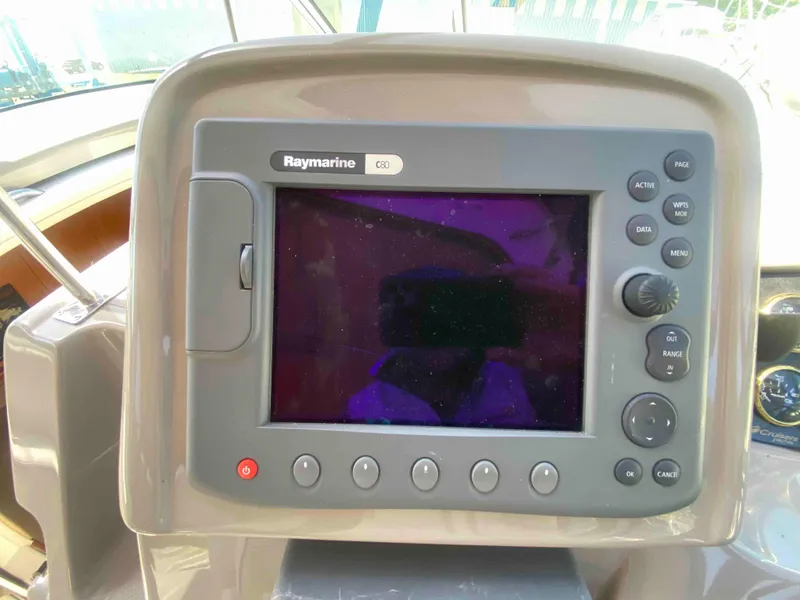 Slide: The Image of Dashboard of 2004 Cruisers Yachts 340 Express with gauges and controls. - 17
