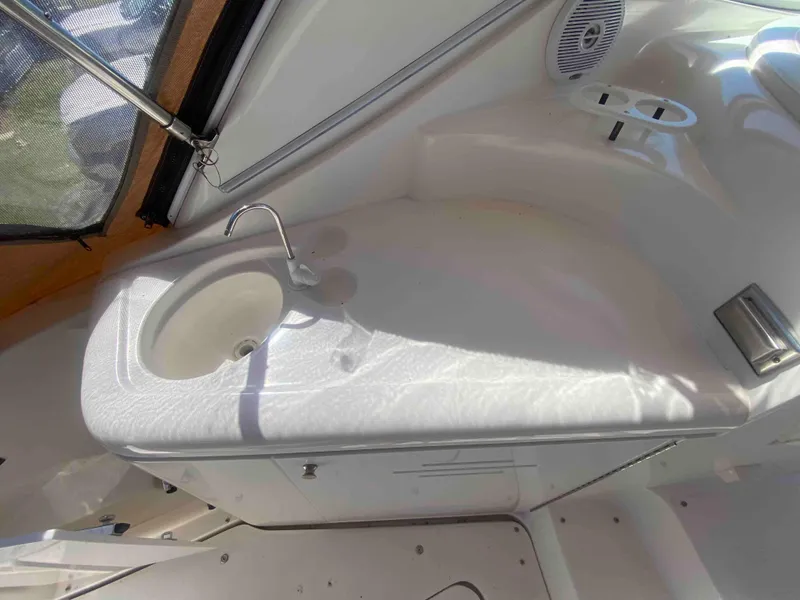 Slide: The Image of Control panel of a 2004 Cruisers Yachts 340 Express with ignition keys inserted. - 20