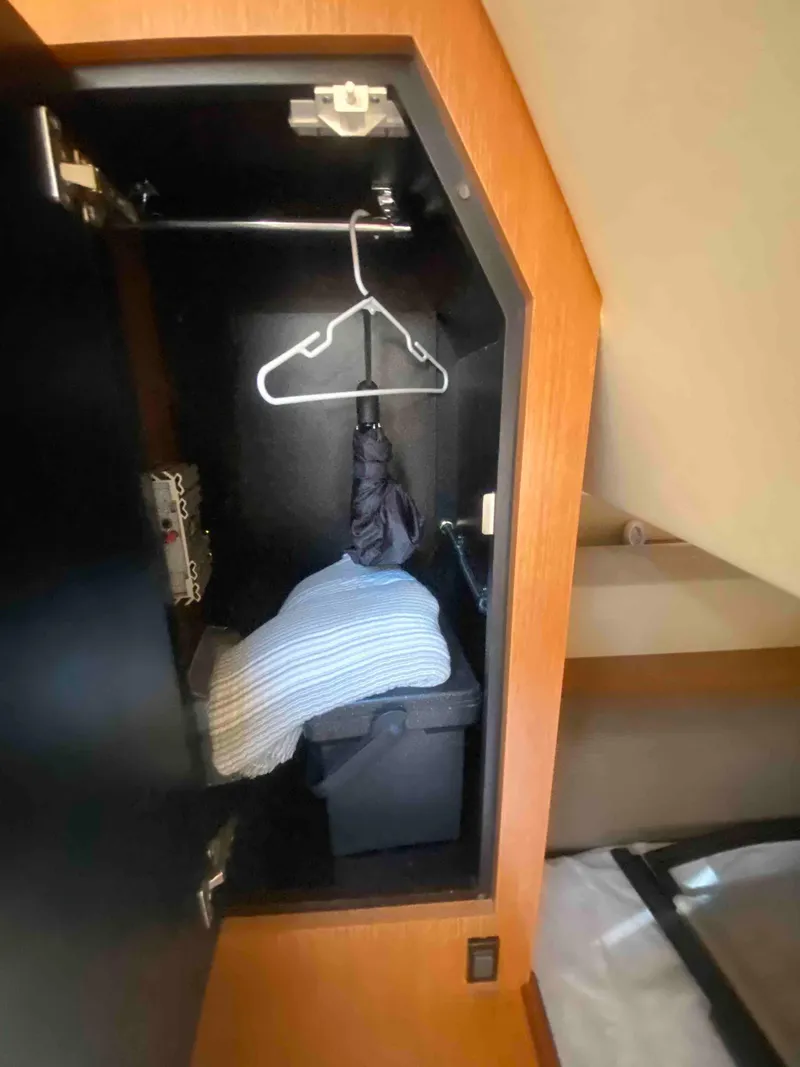 Slide: The Image of 2004 Cruisers Yachts 340 Express cabin interior with bed and pillows. - 41