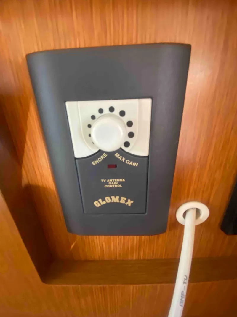 Slide: The Image of 2004 Cruisers Yachts 340 Express interior cabinet with trash bin and fire extinguisher. - 43