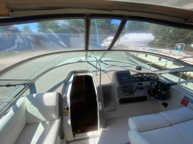 Slide: The Image of Fire extinguisher and storage compartment on 2004 Cruisers Yachts 340 Express. - 22