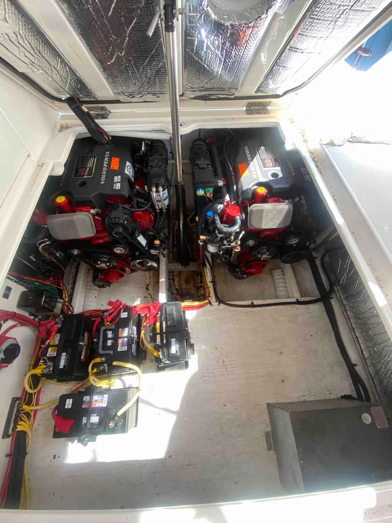 Slide: The Image of Engine compartment of 2004 Cruisers Yachts 340 Express with visible batteries and wiring. - 50