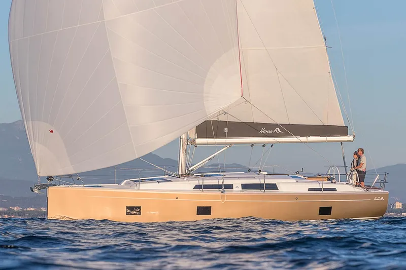 Slide: The Image of 2025 Hanse 418 sailboat cruising on open water with full sails. - 22