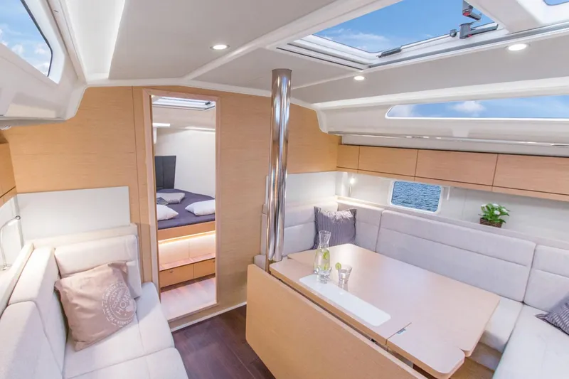 Slide: The Image of Luxurious interior of 2025 Hanse 418 yacht with modern seating and skylight. - 12