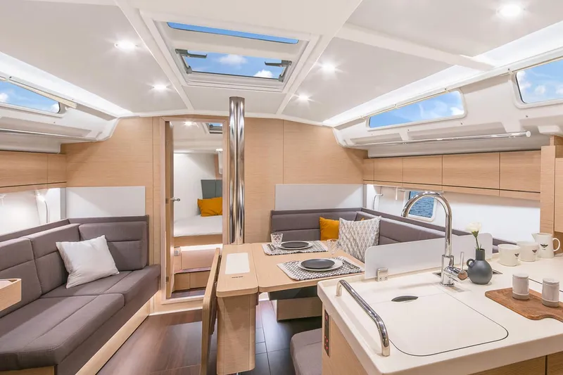 Slide: The Image of Luxurious interior of 2025 Hanse 418 yacht with modern kitchen and seating area. - 7