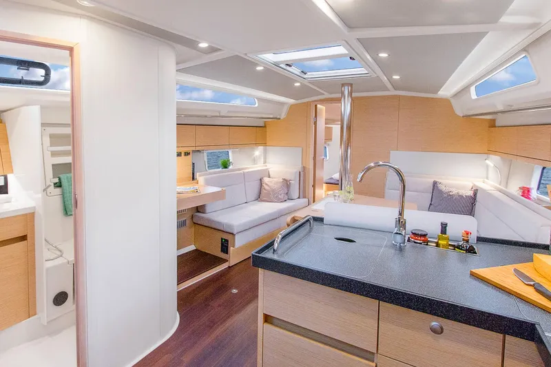 Slide: The Image of Luxurious interior of 2025 Hanse 418 yacht with modern kitchen and seating area. - 8