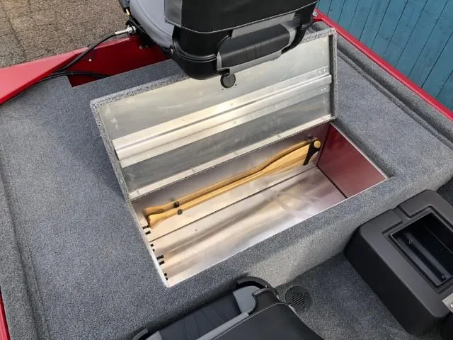 Slide: The Image of 2024 Tracker Bass Tracker Classic XL boat storage compartment with open lid. - 12