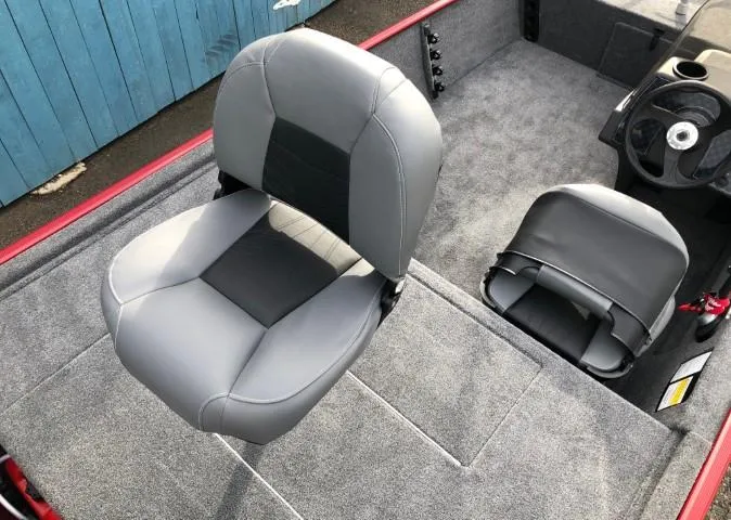 Slide: The Image of 2024 Tracker Bass Tracker Classic XL boat interior with gray seating and carpeted flooring. - 13