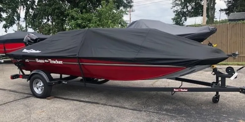 Slide: The Image of 2024 Tracker Bass Tracker Classic XL boat with cover on trailer. - 14