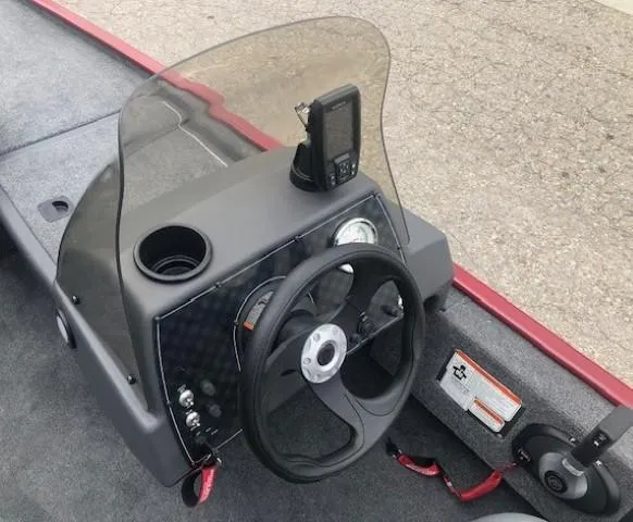 Slide: The Image of 2024 Tracker Bass Tracker Classic XL boat dashboard with steering wheel and fish finder. - 7