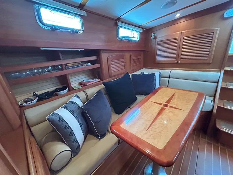 Slide: The Image of Interior of 2006 Sabre 38 Express HDTP MY yacht with helm, seating, and marina view. - 12