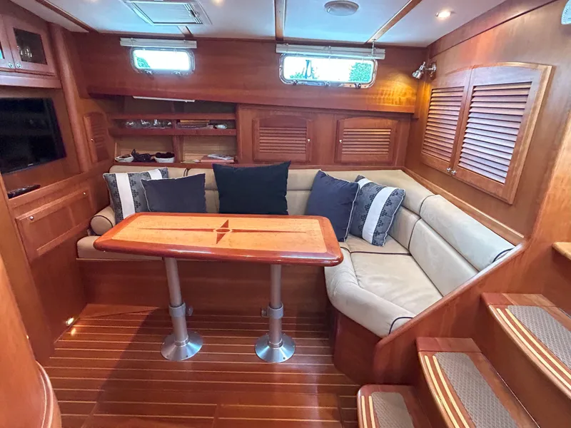 Slide: The Image of Interior of 2006 Sabre 38 Express HDTP MY yacht with helm, seating, and wood accents. - 13
