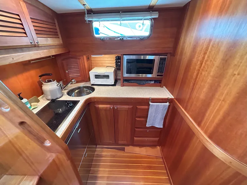 Slide: The Image of Interior of 2006 Sabre 38 Express HDTP MY yacht with helm and navigation equipment. - 14