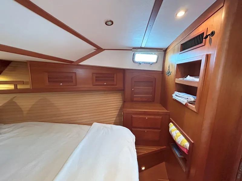 Slide: The Image of Luxurious 2006 Sabre 38 Express yacht interior with elegant wood finish and cozy seating. - 18