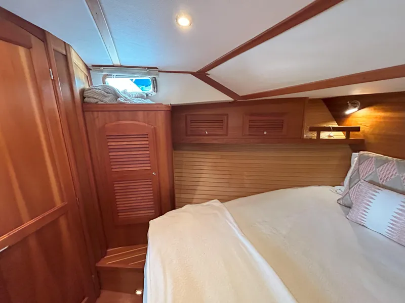 Slide: The Image of Luxurious 2006 Sabre 38 Express yacht interior with wood finish and cozy seating area. - 20