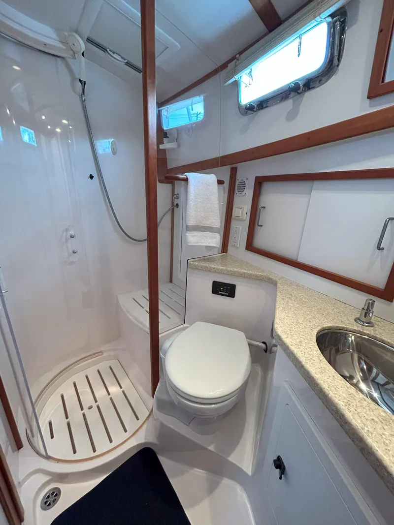 Slide: The Image of Luxurious interior of 2006 Sabre 38 Express HDTP MY yacht with elegant seating and table. - 21