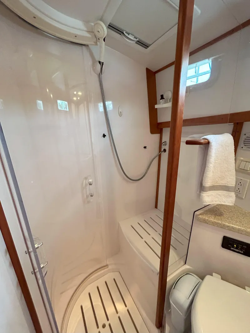 Slide: The Image of Luxurious interior of 2006 Sabre 38 Express HDTP MY yacht with cozy seating and wooden finishes. - 22