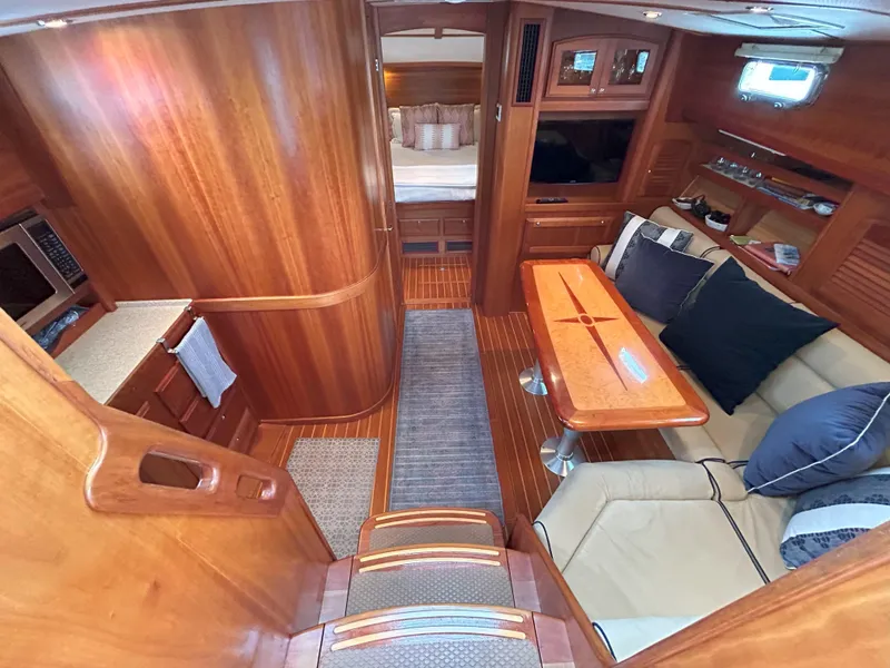 Slide: The Image of 2006 Sabre 38 Express HDTP MY yacht kitchen with wood cabinetry and modern appliances. - 23