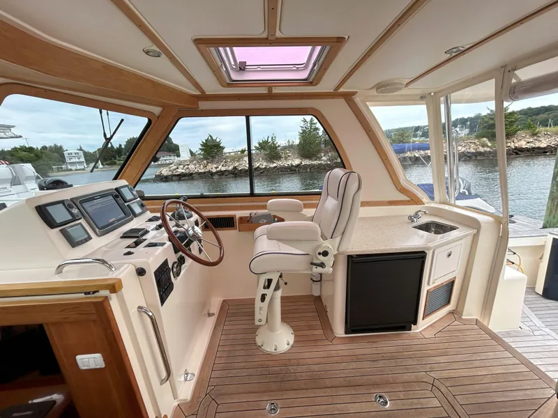 Slide: The Image of 2006 Sabre 38 Express HDTP MY cabin with wooden interior and storage shelves. - 27
