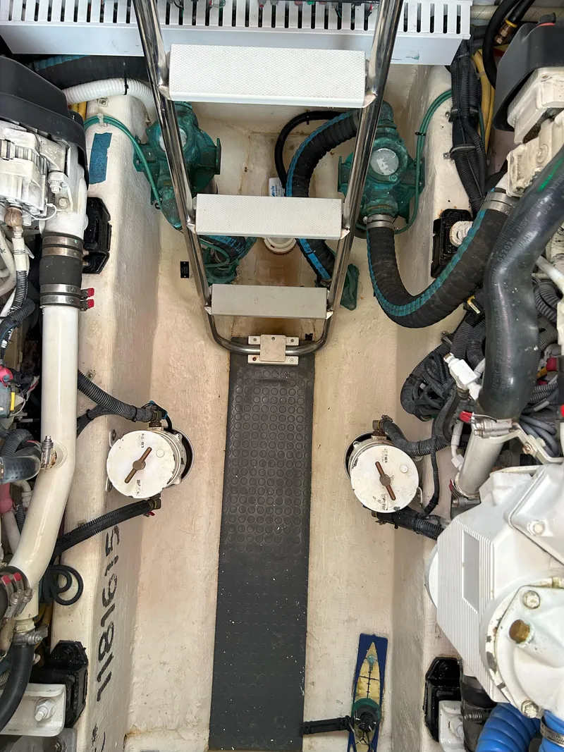 Slide: The Image of Engine compartment of a 2006 Sabre 38 Express HDTP MY boat, showing insulated components and hoses. - 33
