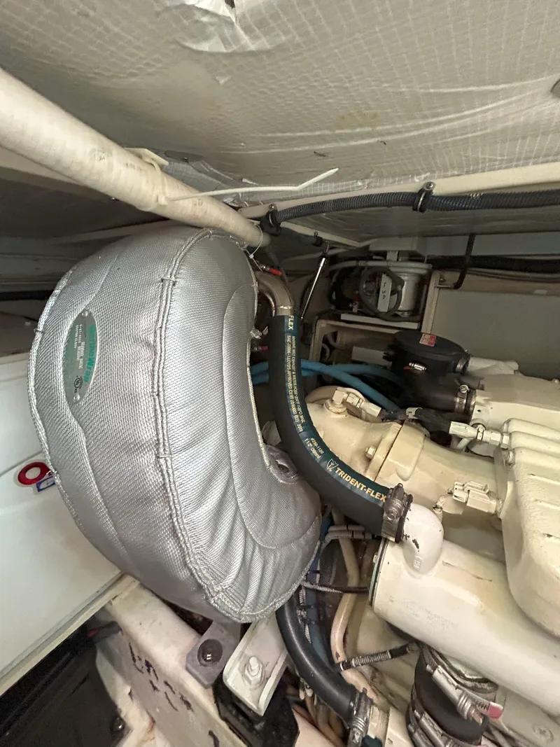 Slide: The Image of Engine of 2006 Sabre 38 Express HDTP MY with visible hoses and components. - 35